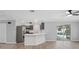 Open floor plan kitchen features stainless appliances, modern countertops, and a breakfast bar at 3631 Palm Dr, Punta Gorda, FL 33950