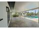A screened-in patio with brick pavers leads to a refreshing pool, offering an ideal space for outdoor enjoyment at 3631 Palm Dr, Punta Gorda, FL 33950