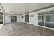 A screened-in patio with brick pavers and sliding doors leads to a refreshing pool at 3631 Palm Dr, Punta Gorda, FL 33950