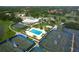 Extensive aerial view showcasing the community's full amenities: tennis, pool, clubhouse at 3634 Torrey Pines Way Way, Sarasota, FL 34238
