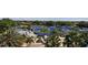 High angle view of multiple tennis courts, a pool, and landscaping in a well-equipped community at 3634 Torrey Pines Way Way, Sarasota, FL 34238