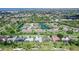 Aerial view of the property in the community surrounded by golf course and lakes at 3634 Torrey Pines Way Way, Sarasota, FL 34238