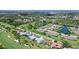 Aerial view of the property on a golf course near lakes and community at 3634 Torrey Pines Way Way, Sarasota, FL 34238