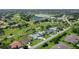 Aerial view of the property surrounded by a golf course and a lake at 3634 Torrey Pines Way Way, Sarasota, FL 34238