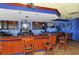 Well-lit bar area with barstool seating, TVs, and beautiful wood finishes at 3634 Torrey Pines Way Way, Sarasota, FL 34238