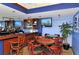 Charming bar area featuring seating, TVs, and a well-stocked bar for entertaining guests at 3634 Torrey Pines Way Way, Sarasota, FL 34238