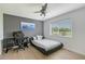 Bedroom with laminate flooring, ceiling fan, and modern decor at 3634 Torrey Pines Way Way, Sarasota, FL 34238