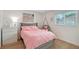 Cozy bedroom with laminate flooring, and a fun, hanging swing chair at 3634 Torrey Pines Way Way, Sarasota, FL 34238