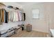 Bright walk-in closet features white wire shelves and a laminate floor at 3634 Torrey Pines Way Way, Sarasota, FL 34238