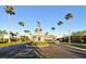 Community entrance with palm trees, manicured landscaping, and an American flag at 3634 Torrey Pines Way Way, Sarasota, FL 34238
