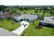 Well-manicured single-story home with a circular driveway and lush landscaping at 3634 Torrey Pines Way Way, Sarasota, FL 34238