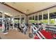 Modern fitness center featuring weight machines, free weights, and mirrored walls, creating an ideal workout environment at 3634 Torrey Pines Way Way, Sarasota, FL 34238