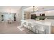 Open concept kitchen with an island with bar stool seating and connecting dining area at 3634 Torrey Pines Way Way, Sarasota, FL 34238