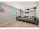 Comfortable living room featuring a large gray sectional sofa and light wood floors at 3634 Torrey Pines Way Way, Sarasota, FL 34238