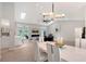 Open-concept living and dining area with modern lighting and easy access to the kitchen at 3634 Torrey Pines Way Way, Sarasota, FL 34238