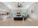 Bright and airy living room with sleek fireplace and views of the backyard at 3634 Torrey Pines Way Way, Sarasota, FL 34238