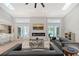 Bright and airy living room features skylights, modern fireplace and backyard views at 3634 Torrey Pines Way Way, Sarasota, FL 34238