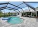 Beautiful screened-in pool with a jacuzzi, an outdoor seating area, and updated patio at 3634 Torrey Pines Way Way, Sarasota, FL 34238
