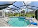 Inviting screened-in pool and spa with lush greenery, perfect for outdoor relaxation and recreation at 3634 Torrey Pines Way Way, Sarasota, FL 34238