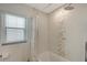 Bathroom shower with decorative tile accent and chrome shower head at 3634 Torrey Pines Way Way, Sarasota, FL 34238