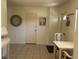 Inviting entryway with tile flooring, a decorative table, and access to various rooms in the home at 4149 Prudence Dr, Sarasota, FL 34235