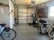 Spacious two car garage with a work area, bike and exercise equipment at 4149 Prudence Dr, Sarasota, FL 34235