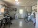 Spacious two car garage with laundry, utility sink, bike, grill and ample storage at 4149 Prudence Dr, Sarasota, FL 34235