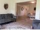 Open living area with stylish furniture, wood-look floors, and a seamless flow to other living spaces at 4149 Prudence Dr, Sarasota, FL 34235