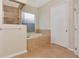 Bathroom with a soaking tub, glass shower, and neutral tile flooring at 4307 70Th E Ave, Ellenton, FL 34222