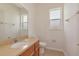 Cozy half bathroom with a single vanity, quartz countertop, and neutral color scheme at 4307 70Th E Ave, Ellenton, FL 34222