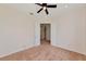 An empty bedroom featuring neutral carpeting and a double door entry at 4307 70Th E Ave, Ellenton, FL 34222