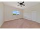 Spacious bedroom with window, ceiling fan, and double door closet at 4307 70Th E Ave, Ellenton, FL 34222