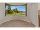 Breakfast nook features pond view, large windows, and tile flooring at 4307 70Th E Ave, Ellenton, FL 34222