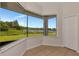 Bright dining area boasting large windows with scenic lake views and neutral tile flooring at 4307 70Th E Ave, Ellenton, FL 34222