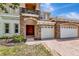 Charming home featuring stone accents, a balcony, a brick driveway, and a three-car garage at 4307 70Th E Ave, Ellenton, FL 34222