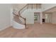 Bright foyer with winding staircase leading to the second floor and views into adjoining rooms at 4307 70Th E Ave, Ellenton, FL 34222