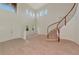 Bright foyer with soaring ceilings, elegant staircase, and neutral tones for a welcoming ambiance at 4307 70Th E Ave, Ellenton, FL 34222