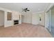 Bright living room featuring a fireplace, ceiling fan, and slider doors to the outside at 4307 70Th E Ave, Ellenton, FL 34222