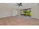 Bright living room with a ceiling fan, large sliding glass doors and neutral carpet at 4307 70Th E Ave, Ellenton, FL 34222