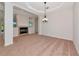 Living room featuring a fireplace, neutral carpet, and a chandelier, with open access to other rooms at 4307 70Th E Ave, Ellenton, FL 34222