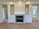 Spacious living room with neutral carpet, fireplace, and decorative columns for a grand aesthetic at 4307 70Th E Ave, Ellenton, FL 34222