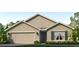 Charming single-story home with a two-car garage, neutral color scheme, and well-manicured lawn at 4324 112Th E St, Palmetto, FL 34221