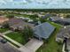An aerial view showing the backyard and the community with pond, trees, and well manicured lawns at 4360 85Th Avenue E Cir, Parrish, FL 34219