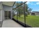Enclosed screened patio with view of a meticulously maintained lawn at 4360 85Th Avenue E Cir, Parrish, FL 34219
