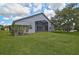 The home's backyard features an enclosed patio and expansive green space at 4360 85Th Avenue E Cir, Parrish, FL 34219