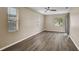 Bedroom boasts stylish flooring, ample natural light, and a modern ceiling fan at 4360 85Th Avenue E Cir, Parrish, FL 34219