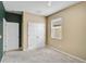 Carpeted bedroom with closet and window providing ample natural light; neutral wall coloring at 4360 85Th Avenue E Cir, Parrish, FL 34219