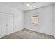 Bright bedroom with carpet, ceiling fan, and window; features a closet for storage at 4360 85Th Avenue E Cir, Parrish, FL 34219