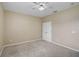 Neutral bedroom features ceiling fan, carpet floors, and a double-door closet at 4360 85Th Avenue E Cir, Parrish, FL 34219