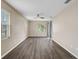 Well-lit bedroom featuring luxury flooring, a ceiling fan and multiple windows at 4360 85Th Avenue E Cir, Parrish, FL 34219